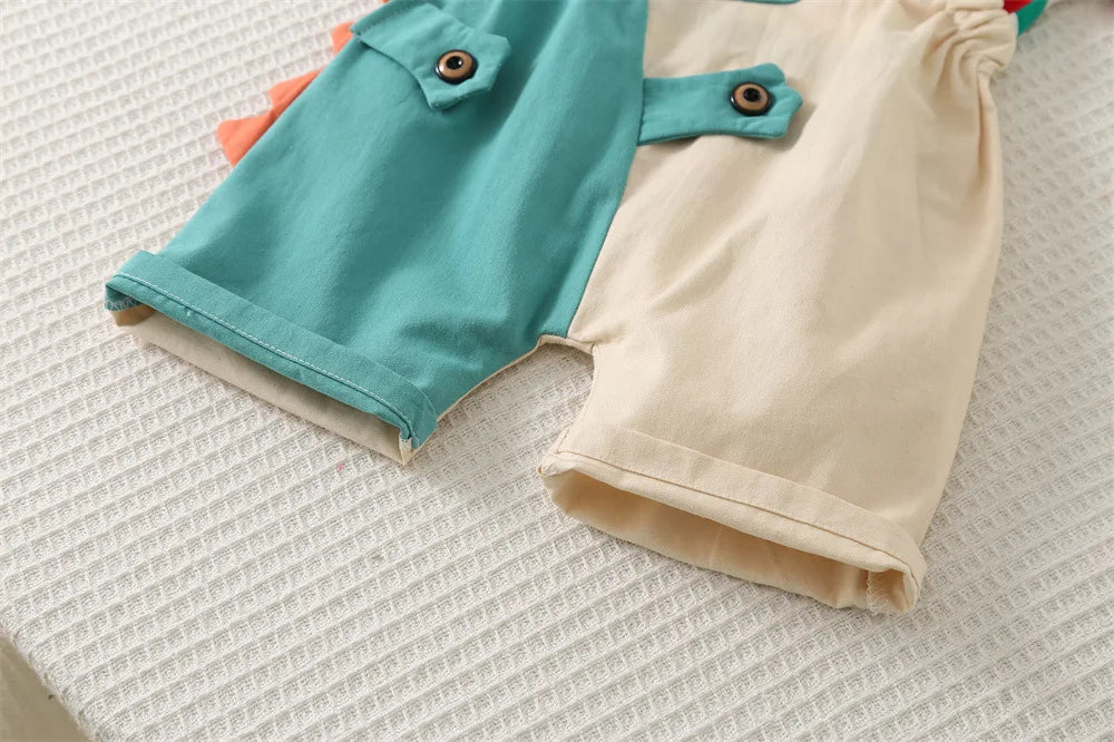 A two-piece outfit set for kids featuring a teal shirt and beige pants.