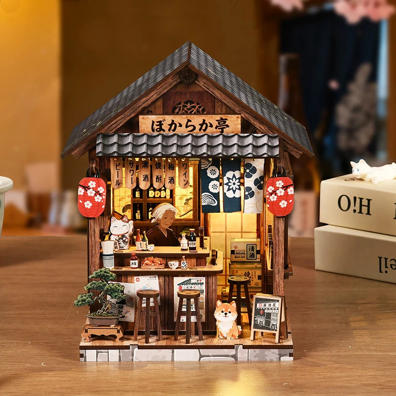 A miniature Japanese izakaya dollhouse kit featuring a wooden facade and interior details.
