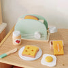 A wooden pretend play tea party set featuring a green and beige food tray with cheese and butter items.