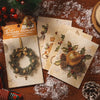 A pack of ten sheets of embossed Christmas adventure decorative paper featuring holiday designs and gilded Christmas themes.