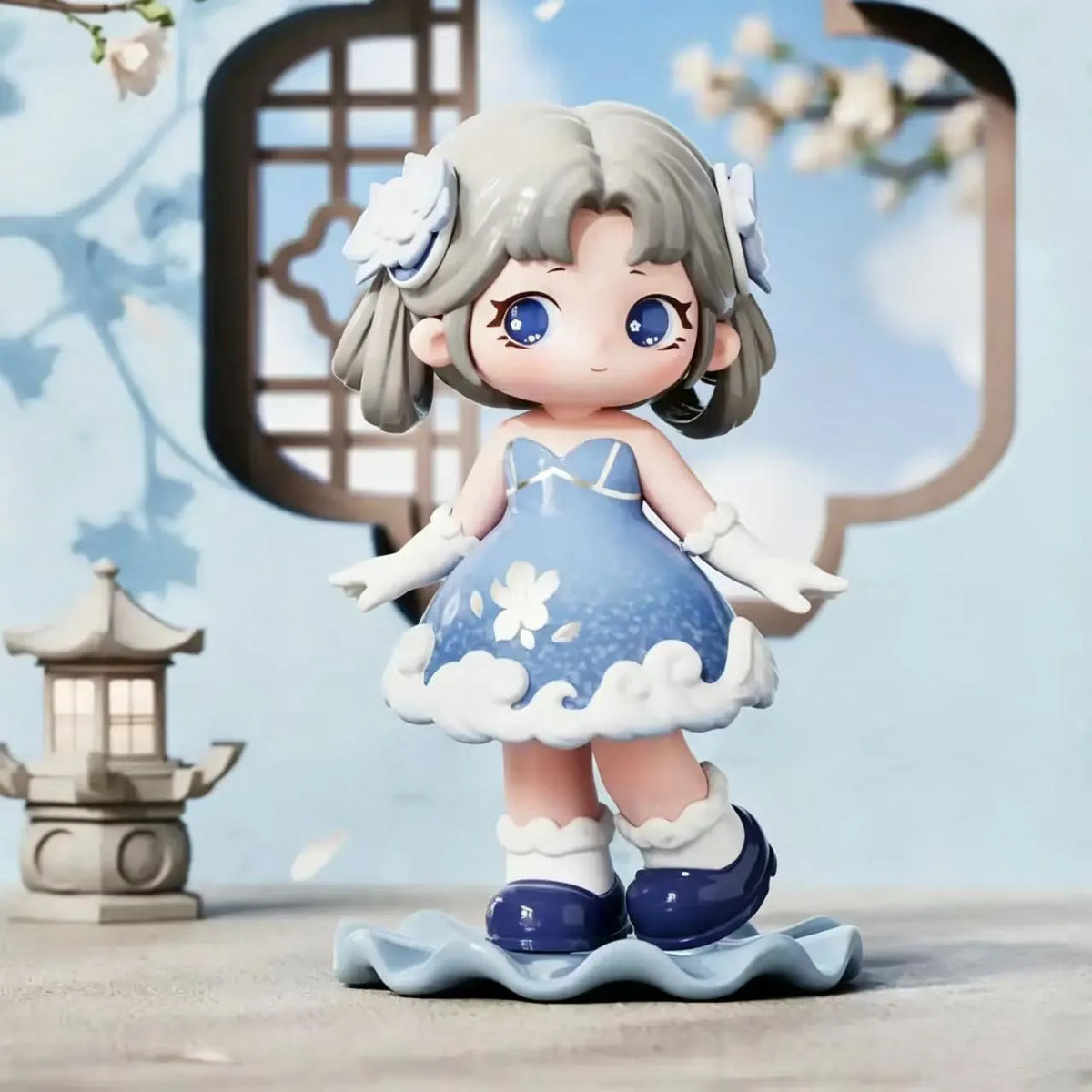 A collectible figurine of a girl with light gray hair and blue eyes wearing a light blue dress with white floral accents.