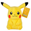 A yellow plush doll of Pikachu with black tips on its ears and cheeks, standing upright.