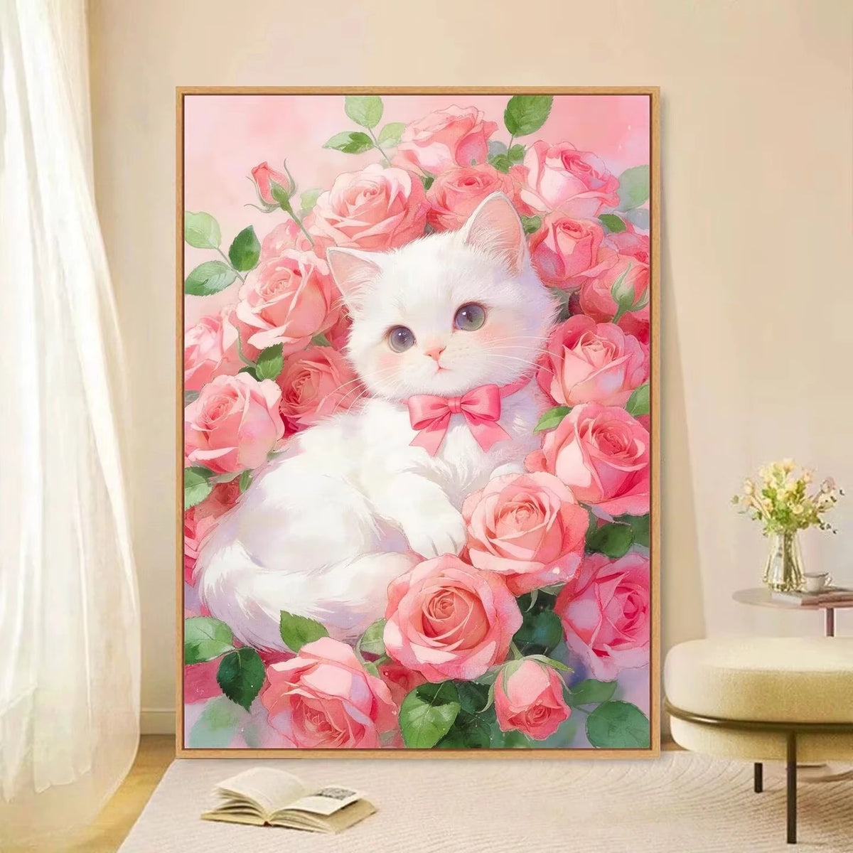 A white cat is nestled among pink and red roses in a diamond painting kit display.