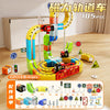 A colorful magnetic anti-gravity train track set with various components and glowing rails laid out on a wooden floor.