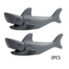 Two gray plastic shark building blocks for marine animal sets