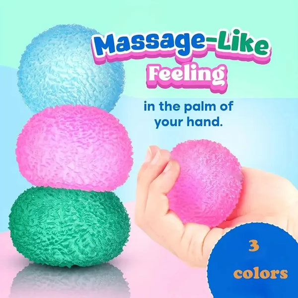 Three colored massage-like feeling squishy balls in the palm of a hand
