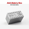 A gray AAA battery box for building blocks, not including the battery.