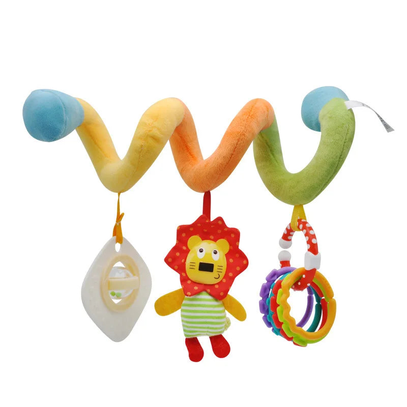 A colorful spiral sensory rattle toy with soft fabric elements and a ring for a baby.