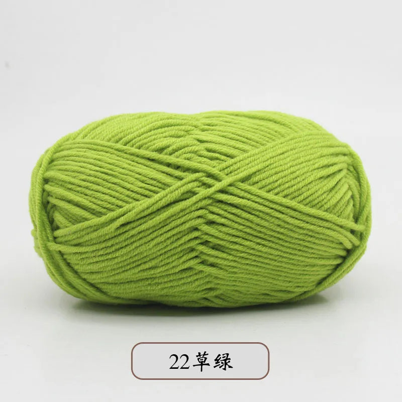 A ball of light green pre-dyed milk cotton yarn, 5-ply blended yarn for knitting and crochet.