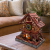 A detailed wooden cuckoo clock puzzle kit featuring a miniature house and figures on a wooden base.