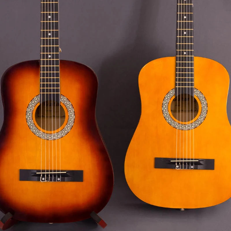 Une paire de guitares classiques oranges à corps en bois avec des trous sonores, présentées sur un fond gris.