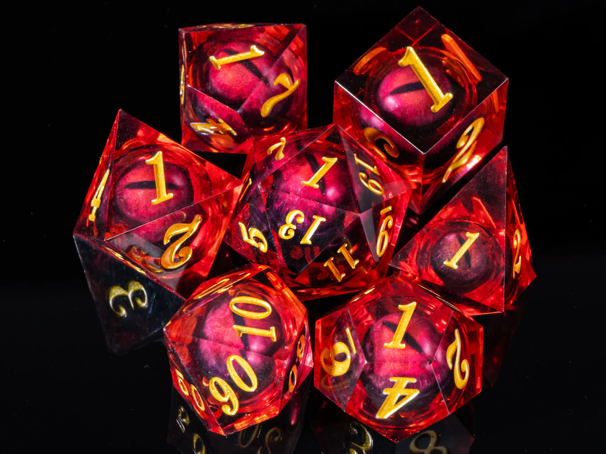 A set of seven red resin polyhedral dice, including a d20 and dodecahedron, displayed against a black background.