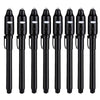 A set of black invisible ink spy pens with UV light for secret messages