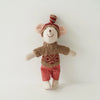 A handmade mouse plush doll wearing a knitted outfit with a red and white checkered top and red shorts.
