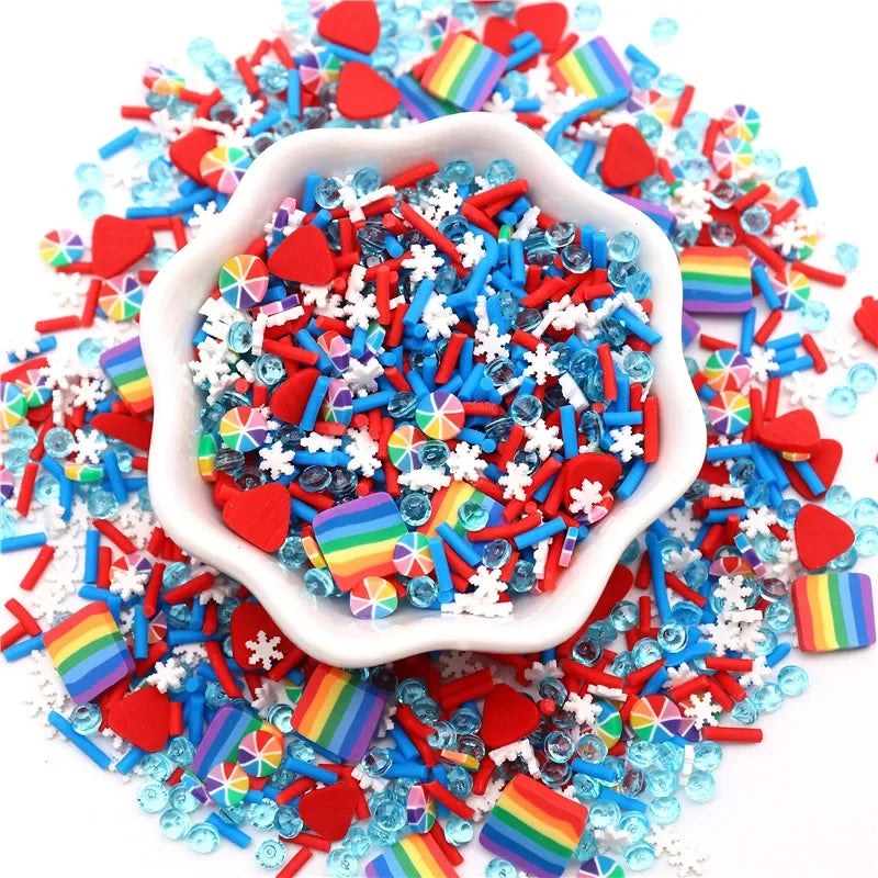 A pile of colorful polymer clay sprinkles mix in various rainbow and solid colors, including red, blue, and white accents.