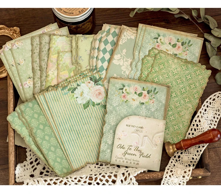A collection of vintage green and pink patterned paper sheets for journaling and scrapbooking