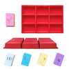 A set of red silicone molds for crafting, including a 9-cavity tray and several small rectangular molds in various colors.