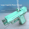 A teal water storage pistol with a large capacity tank is shown on a light gray surface.