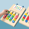 A wooden color and shape matching game with colored wooden pieces and a matching card is shown on a light wooden board.