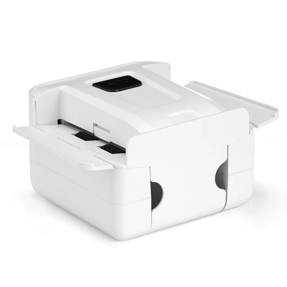 A white portable automatic card shuffler device with a lid open, shown from above.