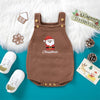 A brown knit baby romper with a white fluffy trim and red Santa embroidery, displayed on a teal background.