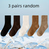 Three pairs of random women's fleece-lined slouch socks in black, brown, white, and tan.