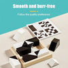 A set of black and white 3D block puzzle cubes arranged in a light wooden storage case with a printed challenge card.