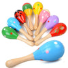 A collection of colorful wooden sand hammers or percussion instruments for kids.