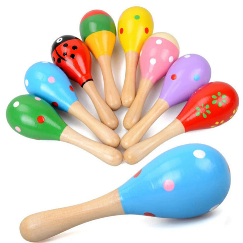 A collection of colorful wooden sand hammers or percussion instruments for kids.