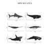 A set of six realistic mini ocean animal figurines including a shark, whale, dolphin, turtle, and penguin.