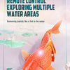 An orange remote control swimming shark toy is shown swimming joyfully in water.