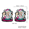 Pink silicone beads featuring a festive Christmas design with a smiling figure and holiday elements.
