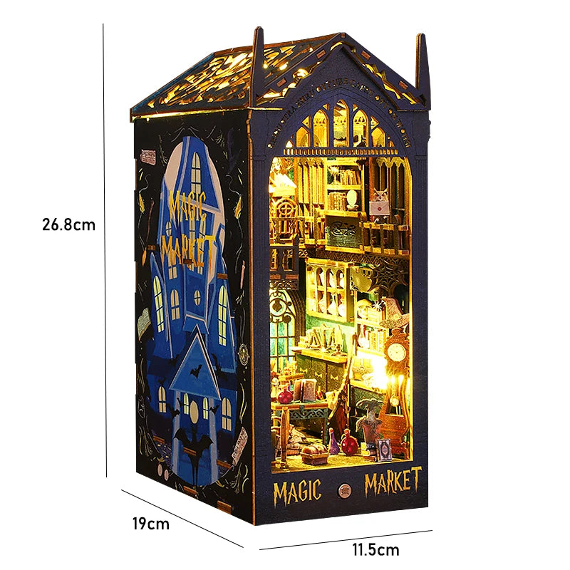A miniature bookshelf book nook kit featuring a detailed market scene with illuminated elements.