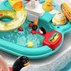 A colorful interactive kids kitchen sink toy featuring running water, a faucet, and various animal figures for play.