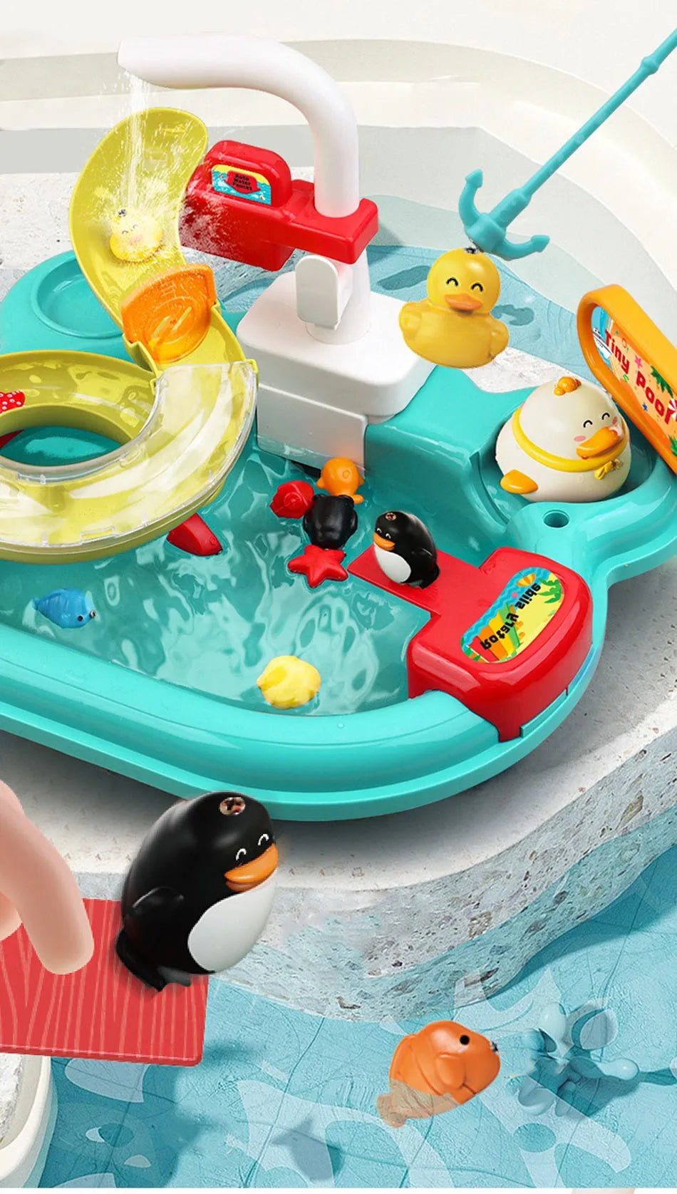 A colorful interactive kids kitchen sink toy featuring running water, a faucet, and various animal figures for play.