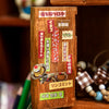 A wooden box containing various Japanese vintage kawaii stickers and labels for scrapbooking