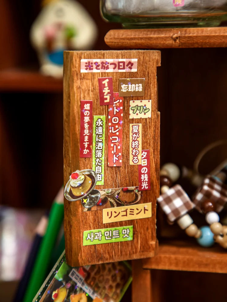 A wooden box containing various Japanese vintage kawaii stickers and labels for scrapbooking