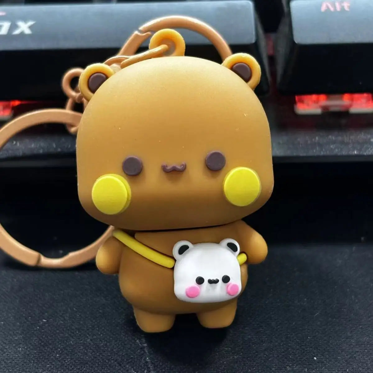 A cute cartoon bear couple keychain set featuring a large brown bear and a small white bear.