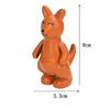 An orange, stylized fox animal building block with black facial features and rounded body.