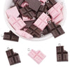 Assortment of pink and dark chocolate DIY sunflower charms for jewelry making