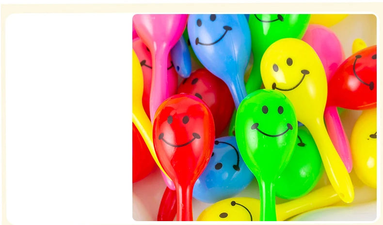 A colorful assortment of mini maracas shaker toys in various bright colors like pink, blue, yellow, and green.