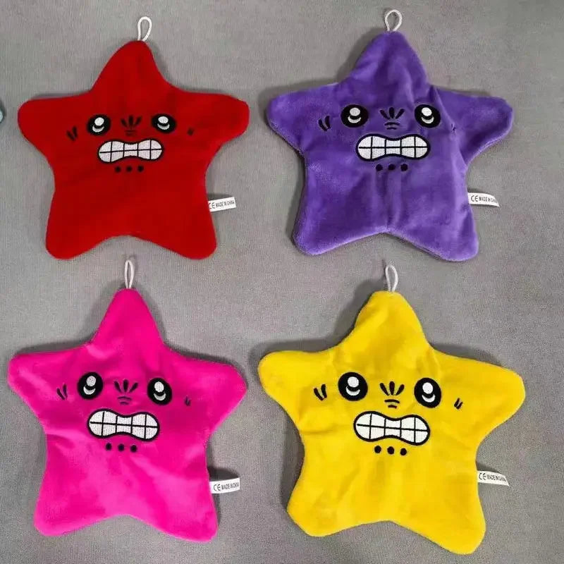 Three star-shaped plush toys in red purple and yellow colors displayed on a gray background.
