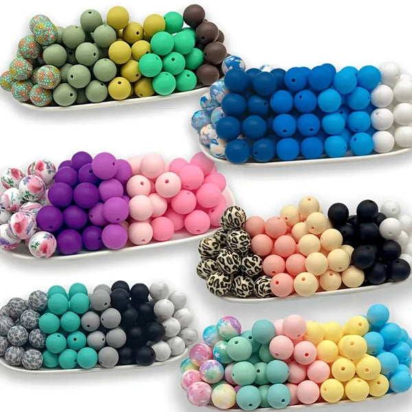 Assortment of colorful silicone floral beads in various shades including blue, green, yellow, pink, and black.