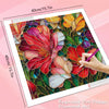 A close-up of a diamond painting kit featuring vibrant red and orange sunflower floral art on a canvas.