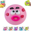 A pink moldable dog face squishy toy with black eyes and a pink ring, shown next to a hand.