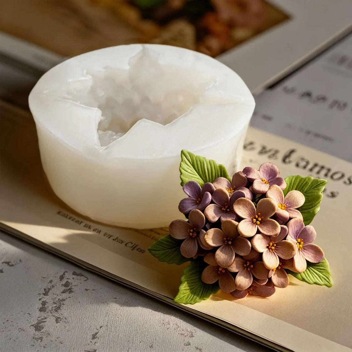 White silicone molds shaped like roses and lilacs for crafting resin candles and soap