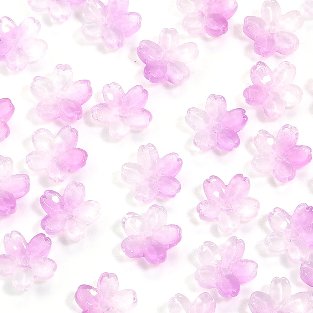 A pile of 50 clear pink cherry blossom flower glass beads for jewelry making