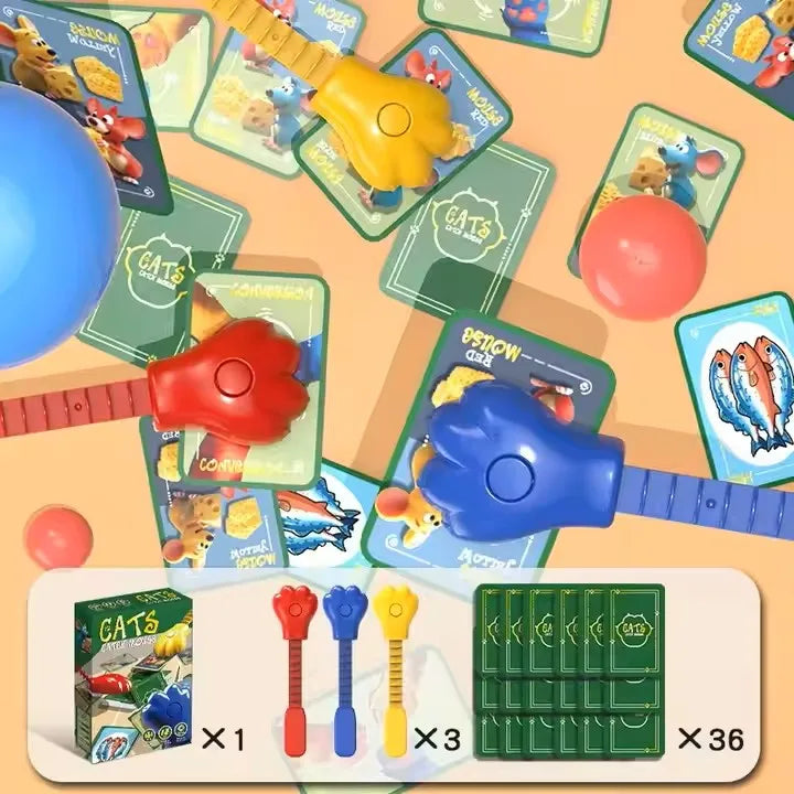 A set of Cat & Mouse reaction battle game components including yellow and red plastic toys, a red ball, and green board piece
