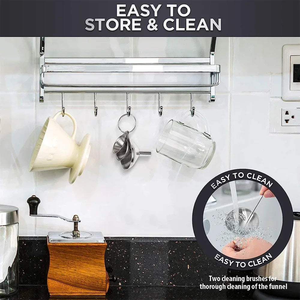 Stainless steel funnel set with three sizes and cleaning brushes hanging on a kitchen rack