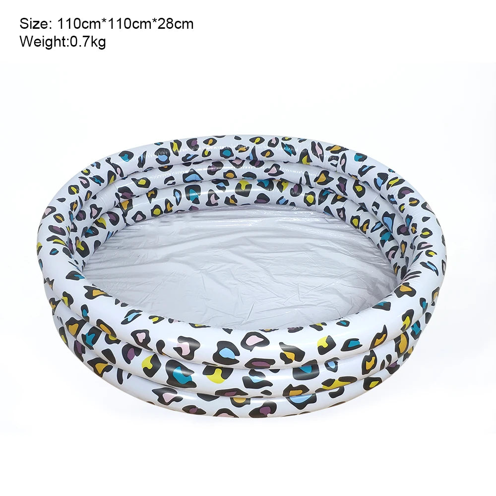 A white inflatable kids play pool with a leopard print cartoon design.